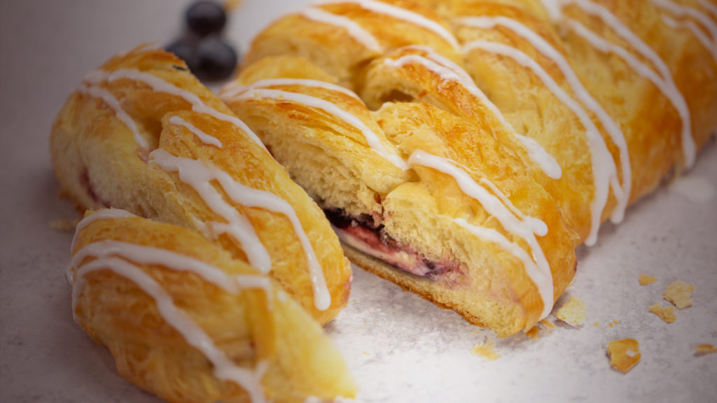 blueberry and cream cheese pastry with blueberries and icing